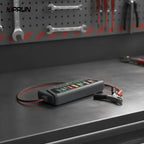 Battery tester on a garage workbench