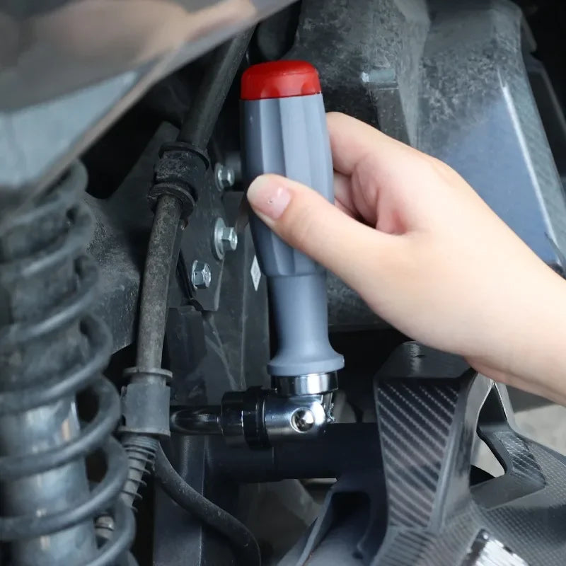 Ratchet screwdriver used in a car engine bay