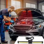 Mechanic using the work light under the bonnet